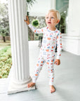 Little Boy Wearing Heyward House Farmer's Market Pajama Set Outside
