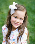 Little Girl Wearing Heyward House Farmer's Market Pajama Set Outside