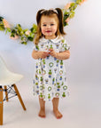 Adorable little girl in floral print dress by Heyward House.