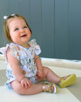Cute smiling baby wearing English Countryside bubble