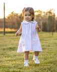 Toddler in Heyward House pima pink and white sleeveless dress