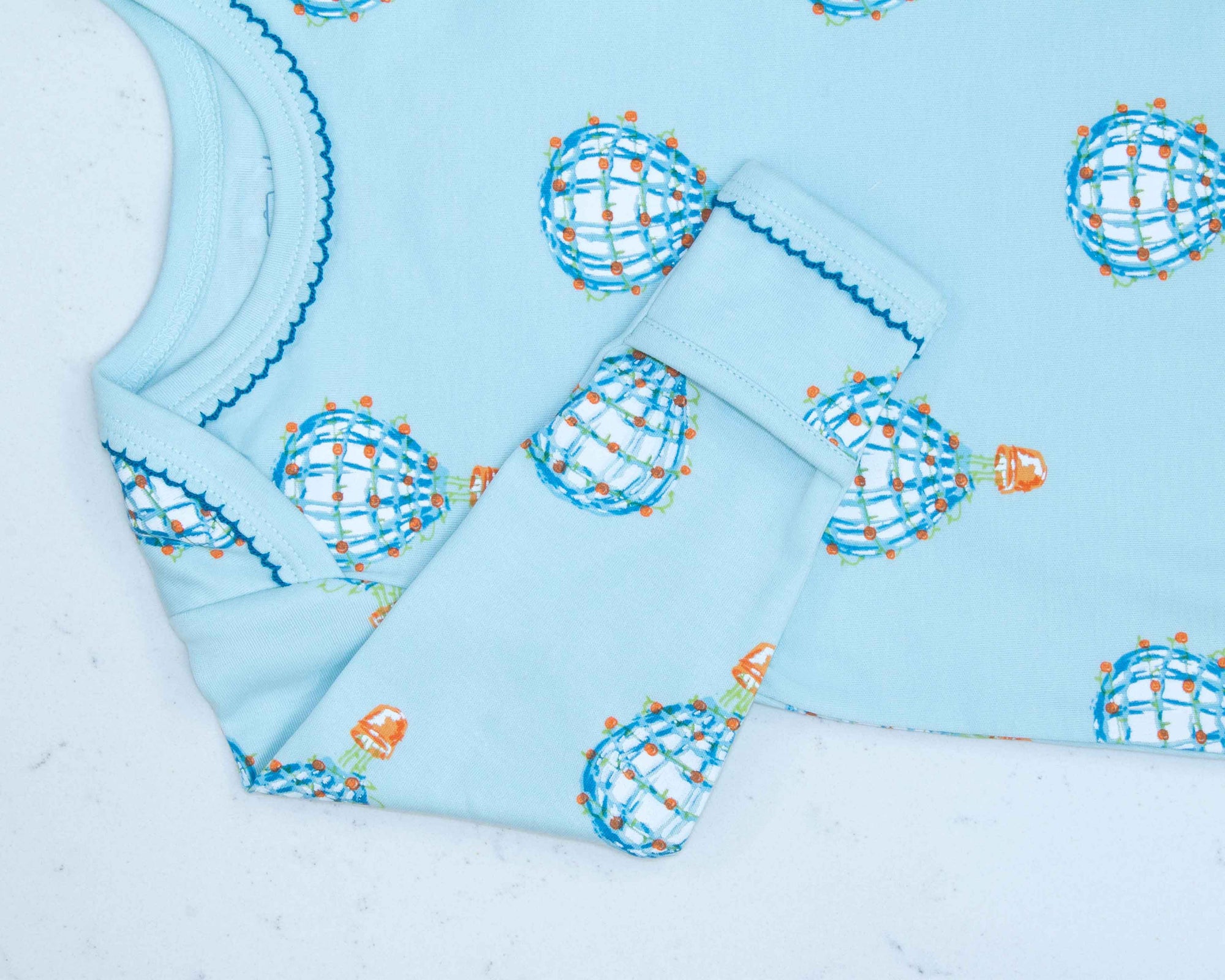 infant gown with hot air balloon pattern with scratch guard detail