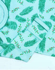 Blue gown with Vintage Christmas Holly pattern with scratch preventer detail view