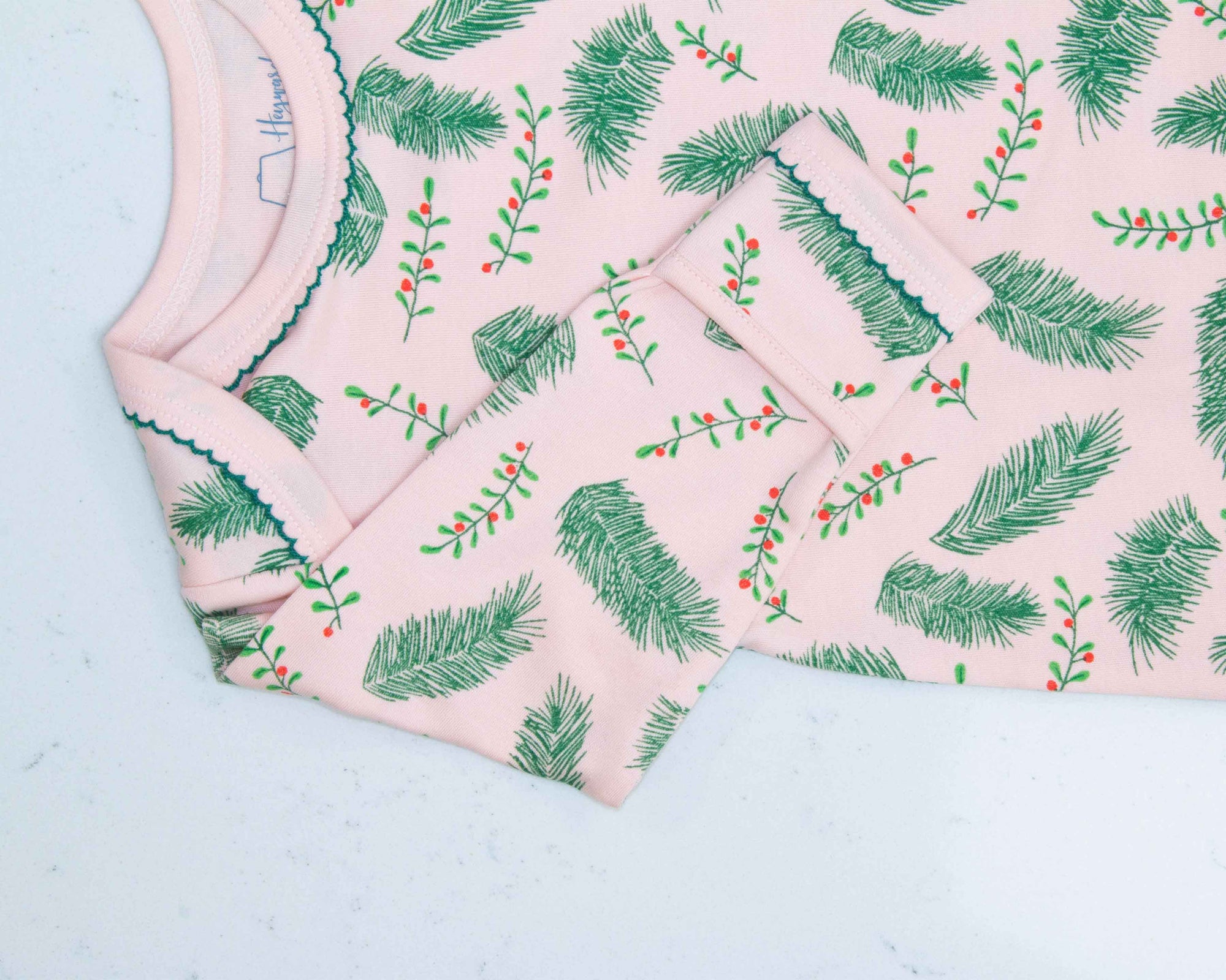 Pink gown with Vintage Christmas Holly pattern with scratch preventer detail view