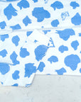 Detail of zipper area of white footed pajama with dog silhouettes pattern made in pima cotton