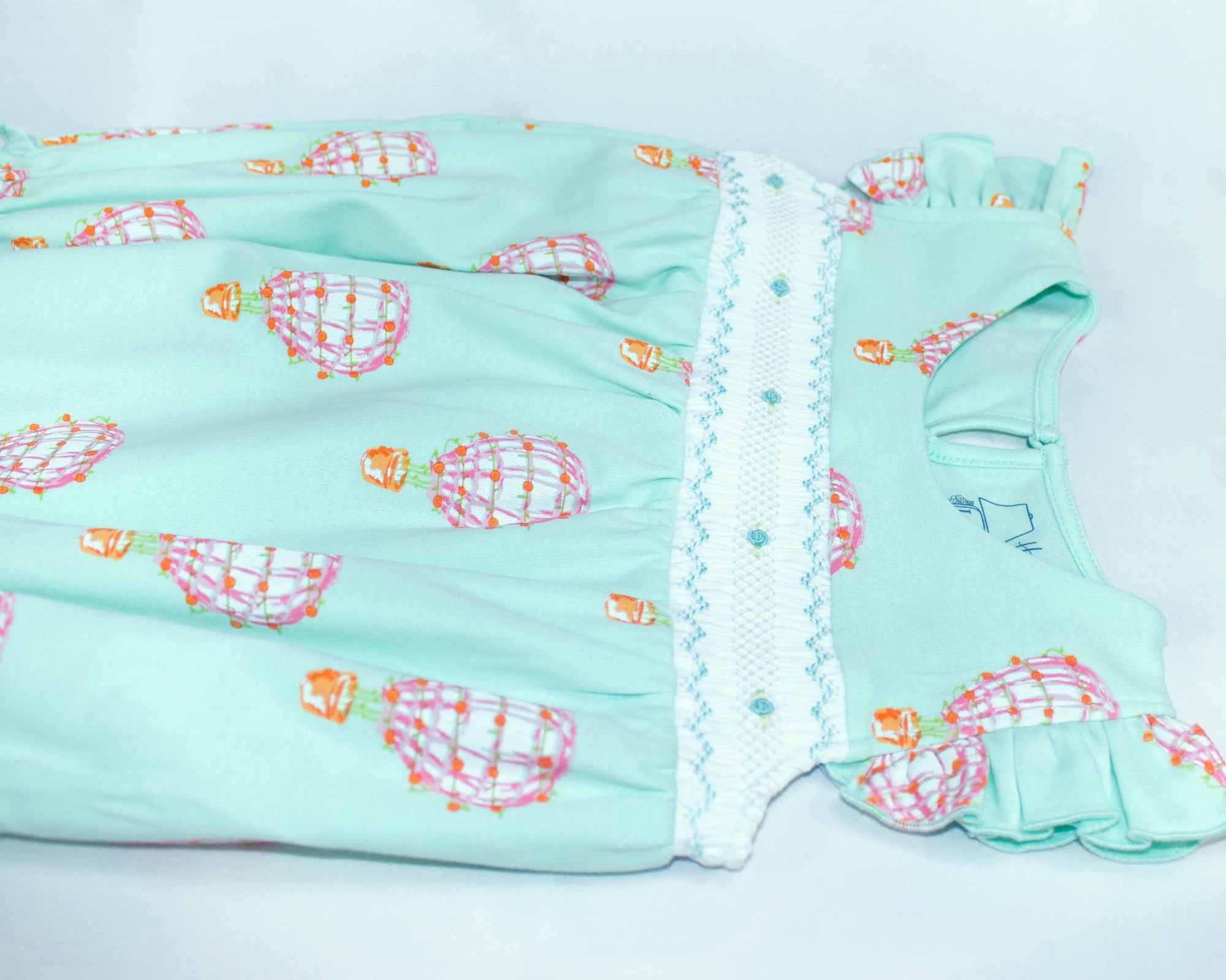 another detailed view of pink girls bubble with smock and hot air balloon pattern made in pima cotton