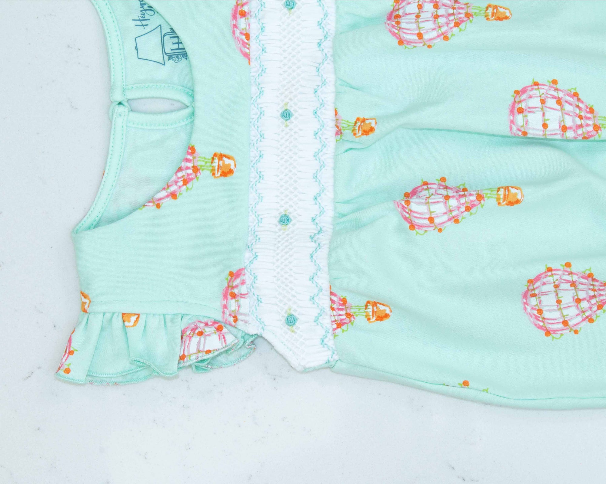 detailed view of pink girls bubble with smock and hot air balloon pattern made in pima cotton