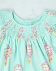 detailed view of pink girls dress with smock and hot air balloon pattern made in pima cotton