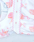 detailed view white girls bubble with smock and vintage-inspired baby carriage pattern made in pima cotton