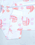 Detail of zipper area of white footed pajama with vintage baby carriage pattern made in pima cotton