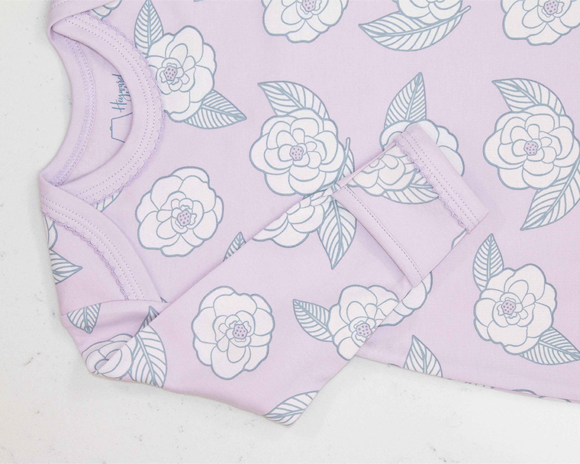 Pink gown with camellia flower pattern with scratch guard detail