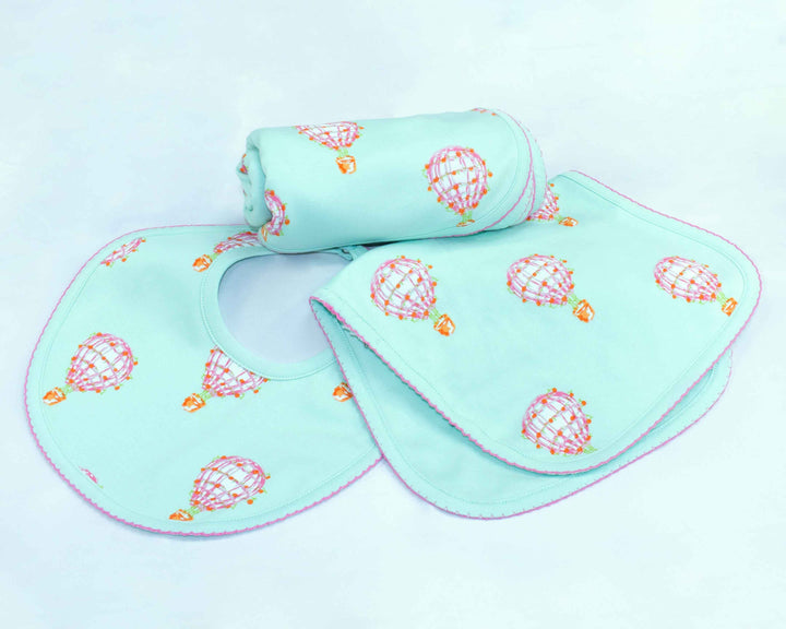 Heyward House | Pink Hot Air Balloon Accessories: Bib, Burp Cloth, and Baby Blanket made from pima cotton