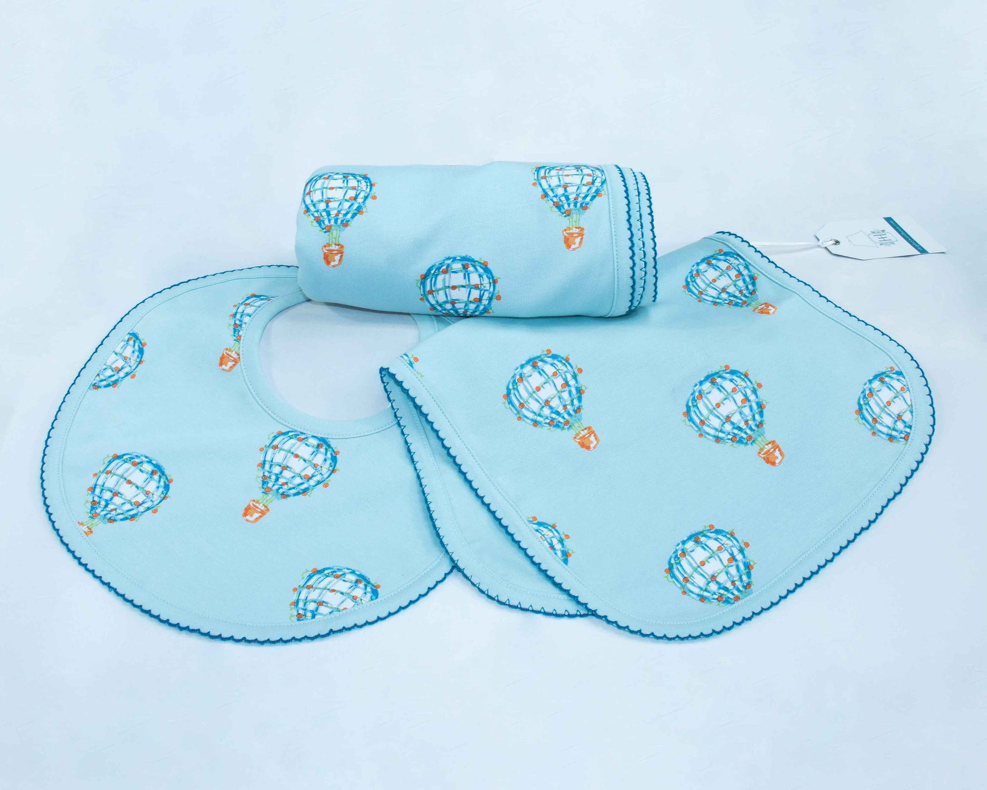 Heyward House | Blue Hot Air Balloon Accessories for baby including pima cotton burp cloth, bib and blanket.