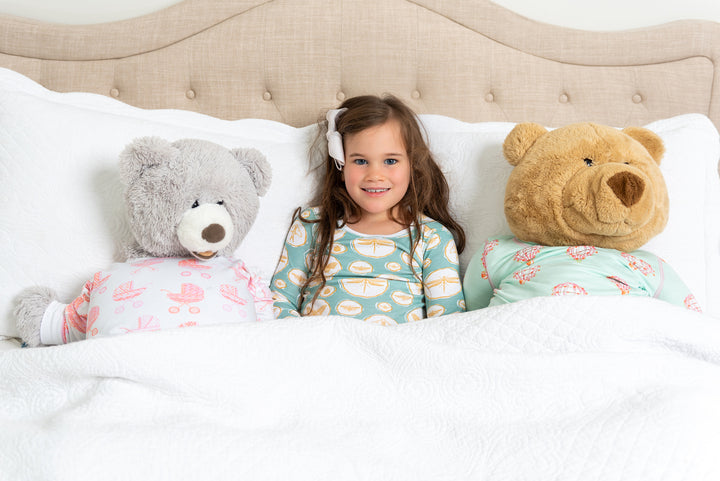 little girl wearing heyward house pima cotton pajamas with bug pattern