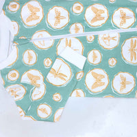 Detail of zipper area of sea green pajama with bug and insect pattern made in pima cotton