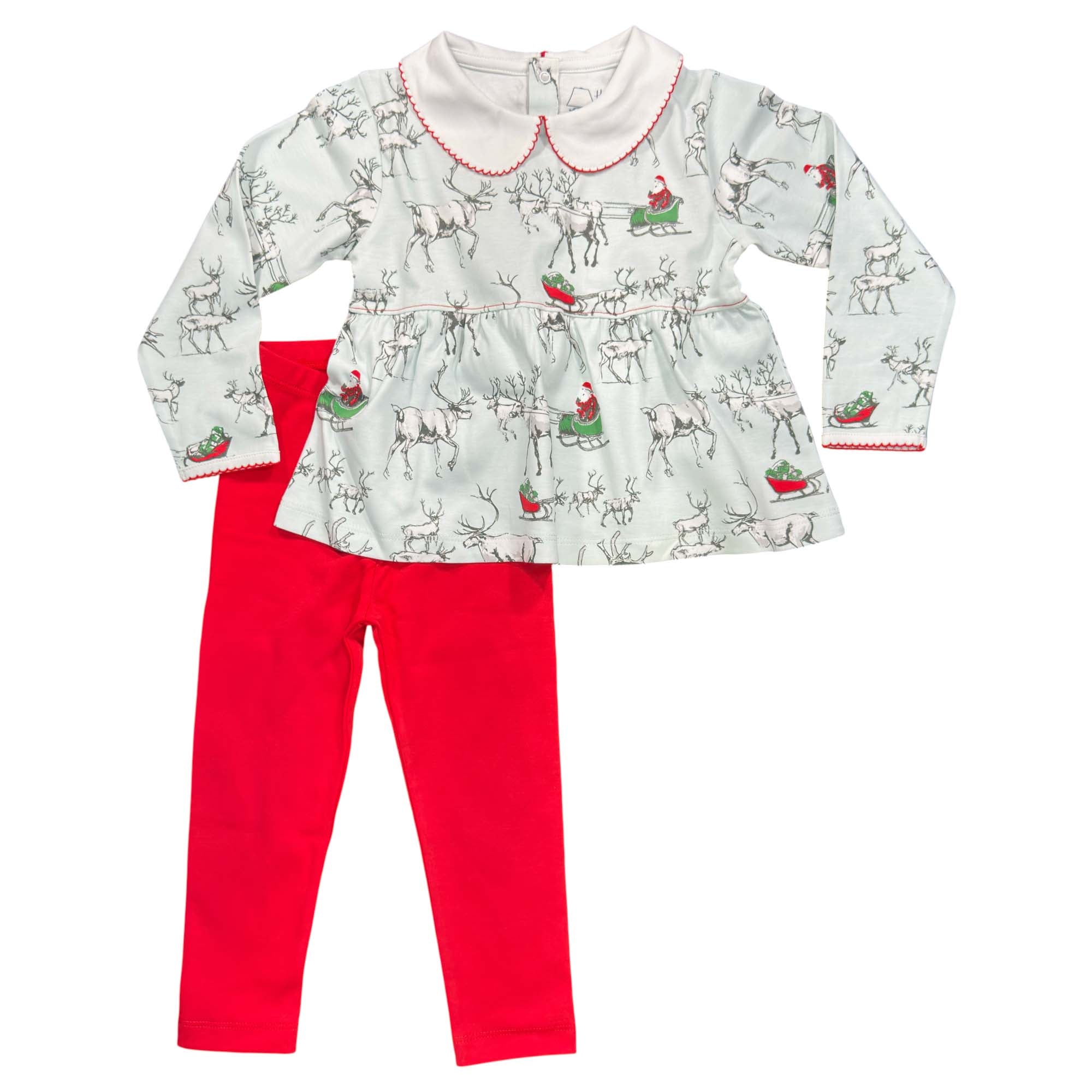 Children's outfit with reindeer top and red pants on a white background