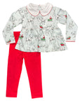 Children's outfit with reindeer top and red pants on a white background