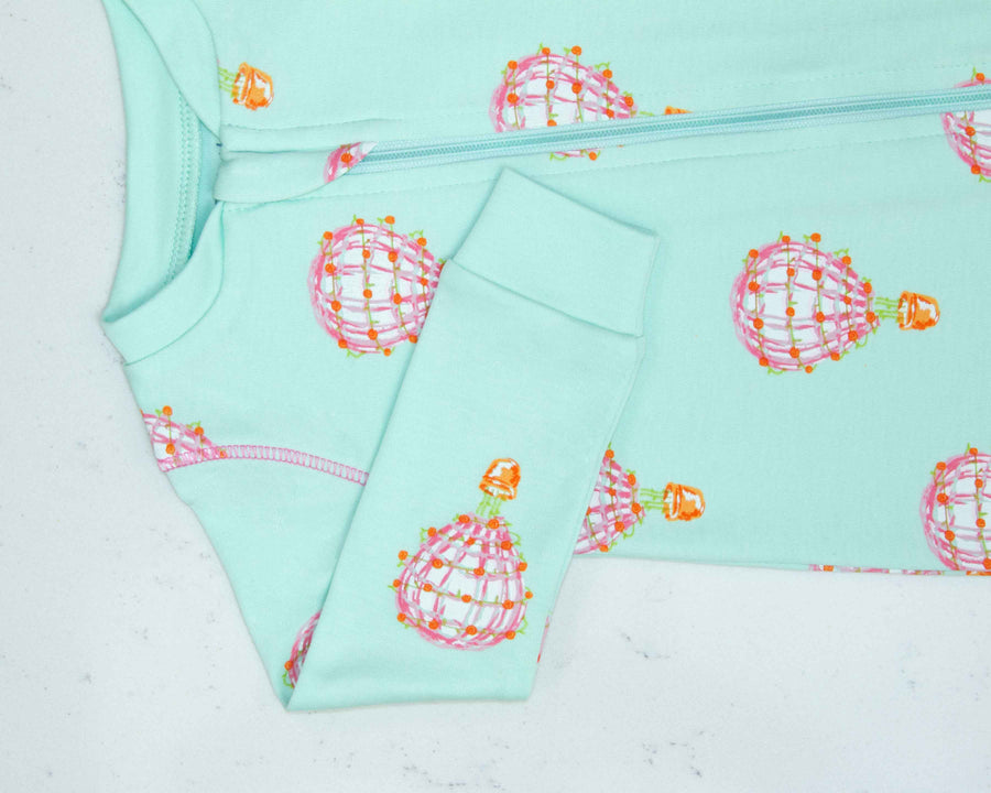 Detail of zipper area of pink pajama with hot air balloon pattern made in pima cotton
