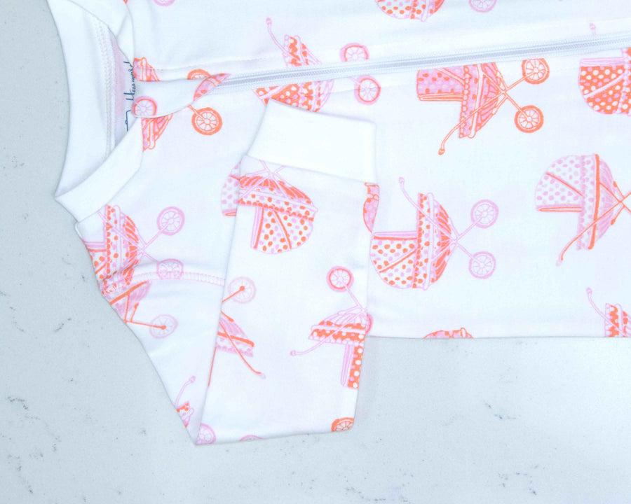Detail of zipper area of white pajama with vintage baby carriage pattern made in pima cotton