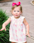 Little girl in Pink Pram Heyward House Smocked Dress