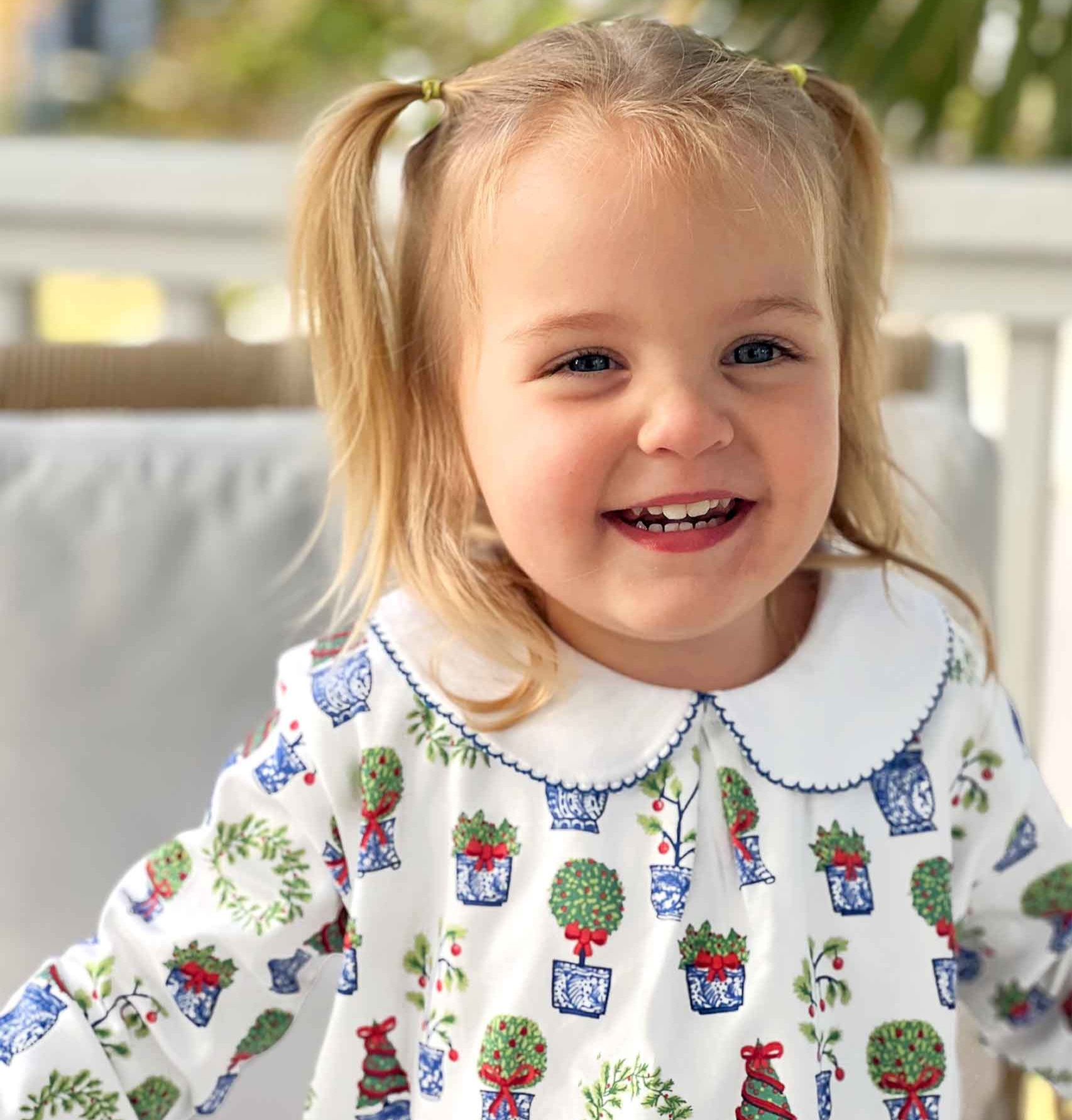 cute smiling girl wearing christmas topiary dress