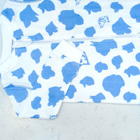 Detail of zipper area of white footed pajama with dog silhouettes pattern made in pima cotton