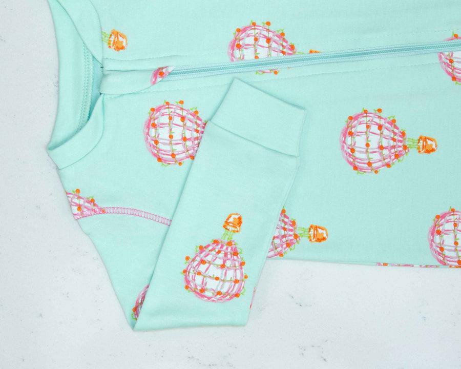 Detail of zipper area of pink footed pajama with hot air balloon pattern made in pima cotton