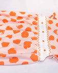 another detailed view pink girls bubble with smock and orange dots pattern made in pima cotton