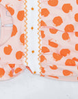 detailed view pink girls bubble with smock and orange dots pattern made in pima cotton