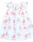 white girls dress with smock and vintage-inspired baby carriage pattern made in pima cotton